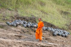 Monk on river bank